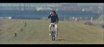 The Petrified Forest 1973 riding bike on grass